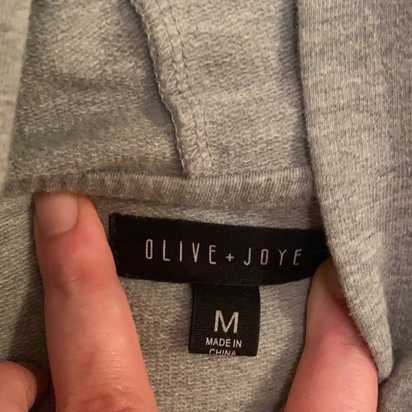 Grey long sleeve hooded crop top with white and red stripes on sleeves. - Picture 3 of 3